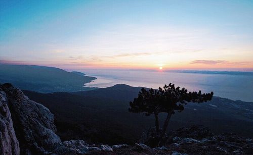 Scenic view of sea at sunset