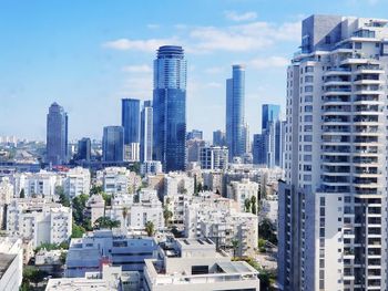 Modern buildings in city against sky