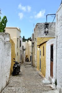 Alley amidst buildings in city