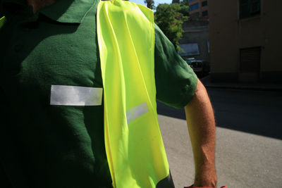 Close-up of a man with yellow flag