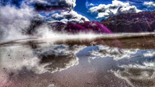 Scenic view of sea against cloudy sky