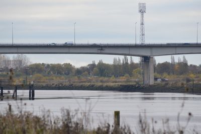 Bridge over river against sky