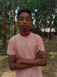 Portrait of young man standing on land