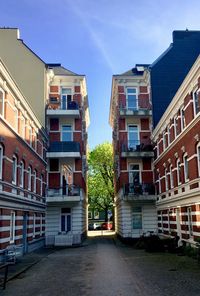 Street amidst buildings against sky