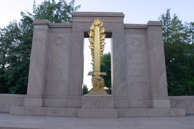 Low angle view of statue against sky