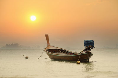 Beautiful boat on a lake in the beautiful red light sunset