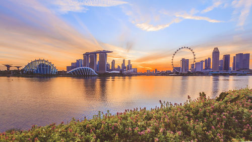 Panoramic view of city buildings against cloudy sky