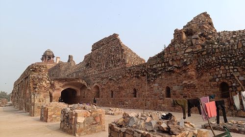 Low angle view of old ruins against clear sky