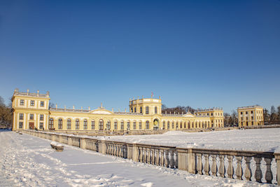 Building against clear blue sky during winter