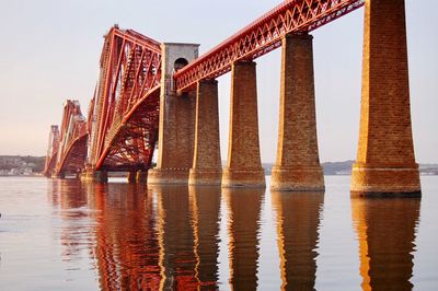 Rail bridge over sea against sky