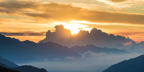 Scenic view of mountains against sky during sunset