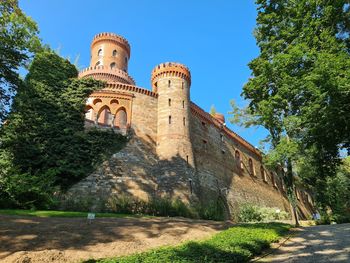 Low angle view of historical building against blue sky