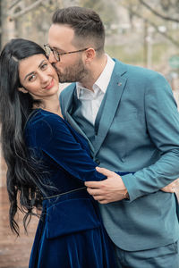 Young couple standing outdoors