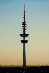 Communications tower against clear sky