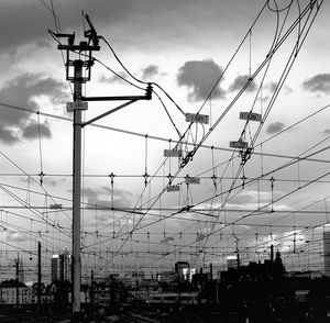 Low angle view of electricity pylon against sky