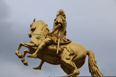 Low angle view of statue against sky