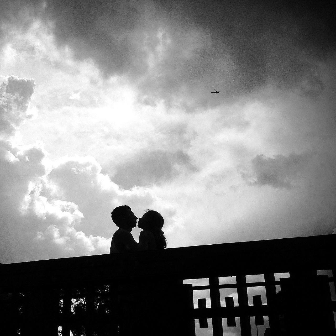 silhouette, sky, men, lifestyles, togetherness, cloud - sky, leisure activity, low angle view, bonding, cloudy, person, outline, standing, boys, childhood, cloud, love