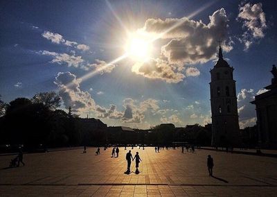 Silhouette of people in city