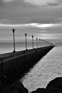 Pier on sea against sky