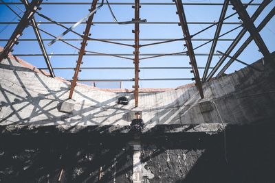 Low angle view of metal structure against sky