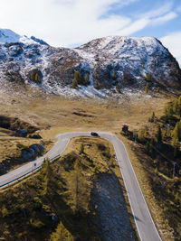 High angle view of road by mountain against sky