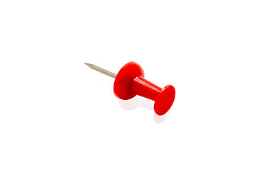 Close-up of red toy against white background