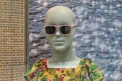 Close-up of sunglasses on stone wall