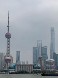 Modern buildings in city against sky