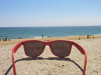 Scenic view of beach against clear sky