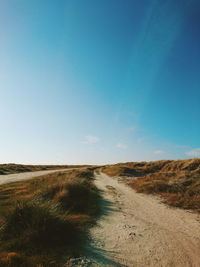 Scenic view of landscape against clear blue sky