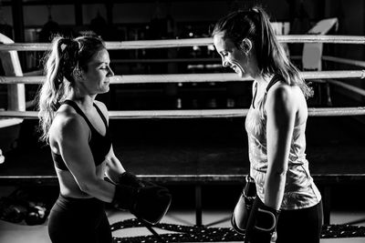 Women saluting after boxing match