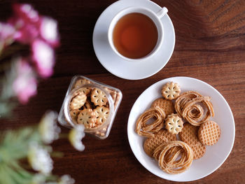 High angle view of evening tea food on a wooden table