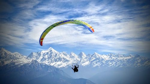 Tourists flying over mountain