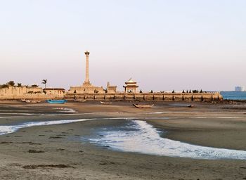 Scenic view of beach against clear sky