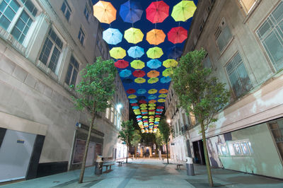 Low angle view of illuminated street at night