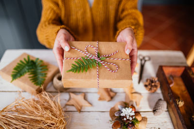 Midsection of woman holding gift box