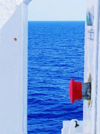 Boat sailing in sea against sky