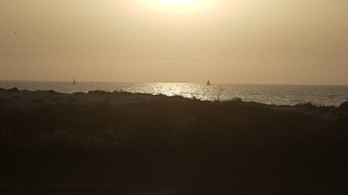 Scenic view of sea against clear sky during sunset