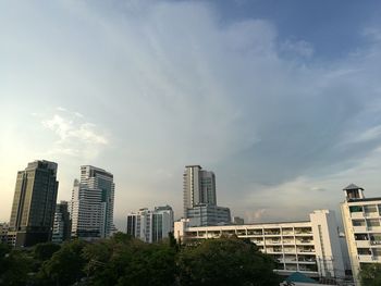 Modern buildings in city against sky