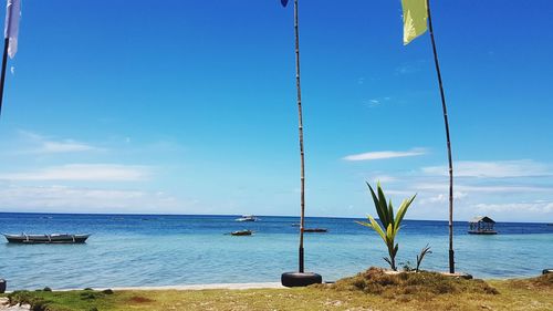 Scenic view of sea against blue sky