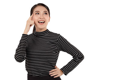 Portrait of a smiling young woman over white background