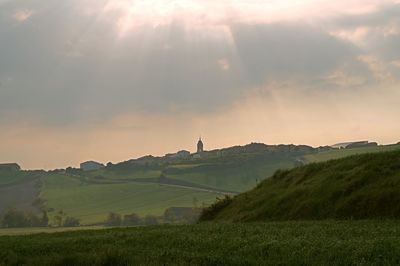 Scenic view of field against sky during sunset