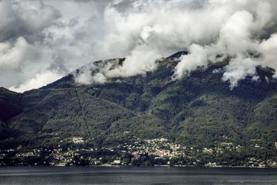 Scenic view of mountains against cloudy sky