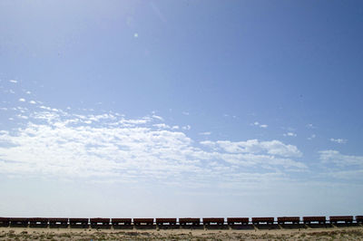 Scenic view of train against sky