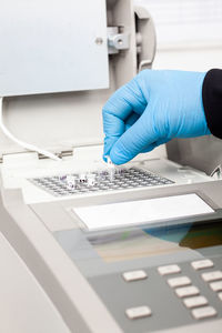 Scientist working at the laboratory with a thermal cycler. polymerase chain reaction technique. 