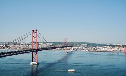 View of the tagus river in lisbon with the bridge of the ponte 25 de abril, lisbon portugal