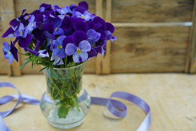 Close-up of purple flowers in vase on table