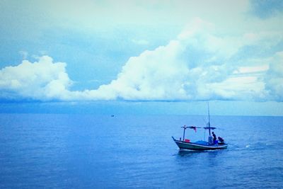 Boat in sea against sky