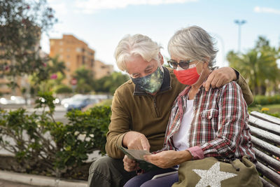 Couple sitting outdoors