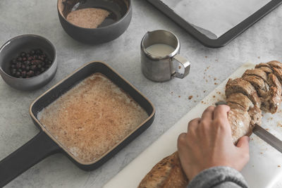 High angle view of man preparing food on table